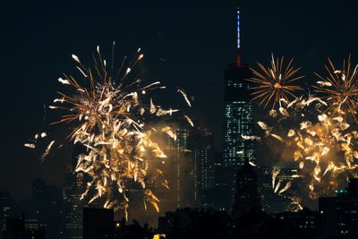 Fireworks exploding over New York City skyline