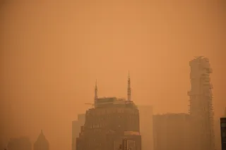 Building rooftops in Manhattan’s Soho neighborhood under orange-tinted sky